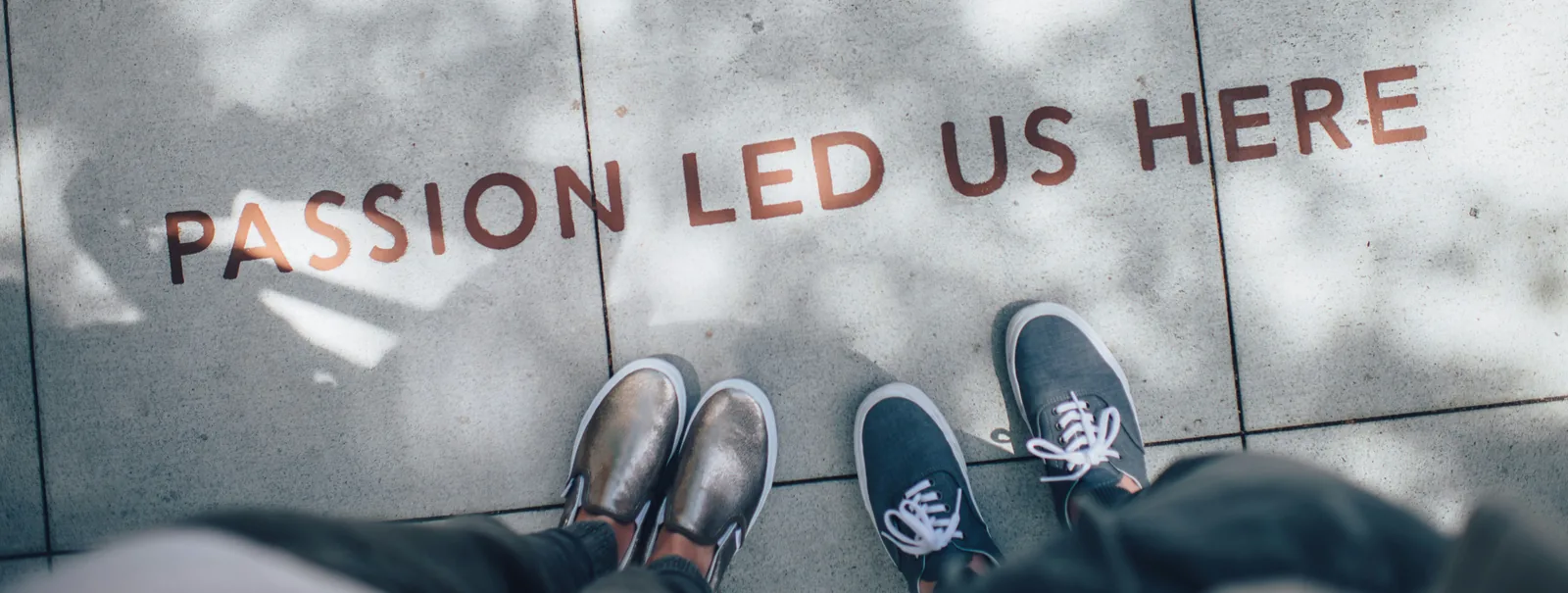 “Passion led us here” written on a pavement